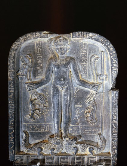 Stele with relief sculpture of Horus with the side lock of hair of youth, standing on two crocodiles