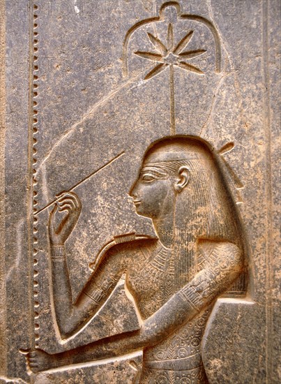 The goddess Seshat, personification of Writing, shown in the act of inscribing the palm leaf rib which denotes the word renpet, year in the hieroglyphic script