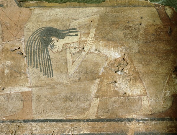 Detail of a painted wooden coffin depicting a mourning woman during a funeral procession