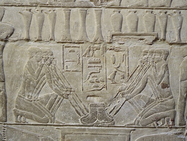 A detail of a relief in the tomb of Mereruka which depicts metalworkers and dwarfs employed in the manufacture of jewellery
