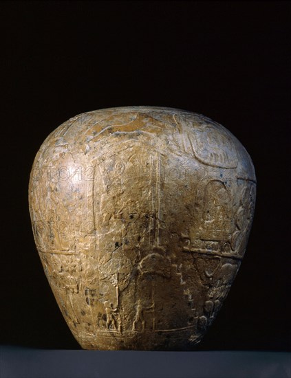 The completely preserved votive mace head of Narmer is decorated with scenes in relief, arranged in registers