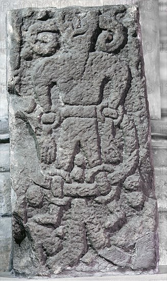 The Bound Devil on a cross at Kirkby Stephen, Cumbria