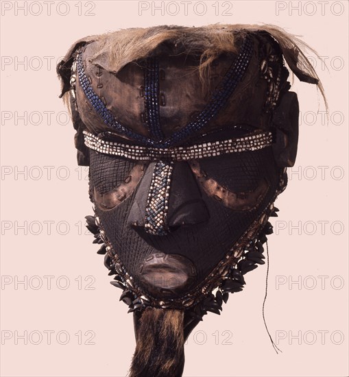 A helmet mask known as Mboom or Bwoom representing local pygmies, the common people, in a play retelling the myth of Bushoong royal origins, performed at major funerals, royal ceremonies and initiations