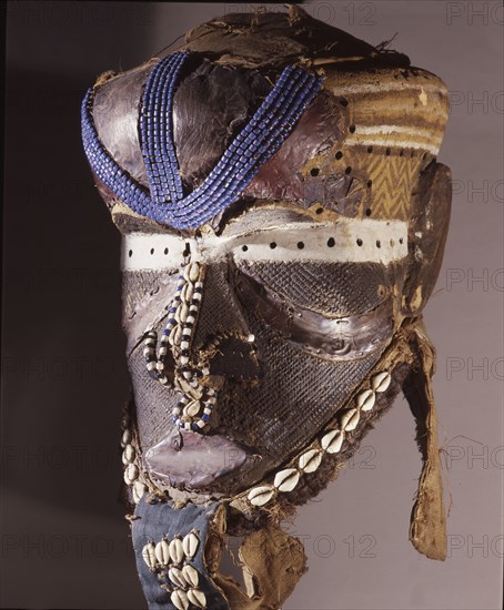 A helmet mask known as Mboom or Bwoom representing local pygmies, the common people, in a play retelling the myth of Bushoong royal origins, performed at major funerals, royal ceremonies and initiations