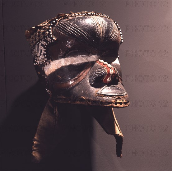 A helmet mask known as Mboom or Bwoom representing local pygmies, the common people, in a play retelling the myth of Bushoong royal origins, performed at major funerals, royal ceremonies and initiations