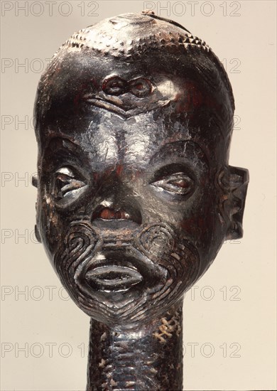 A standing figure with scarification design which was used in the Chibola cult