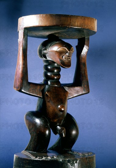 Stool supported by a male figure, served as an emblem of status and prestige for Songye chiefs