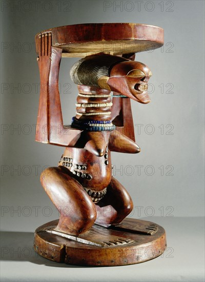 Stool supported by a female figure, served as an emblem of status and prestige for Songye chiefs