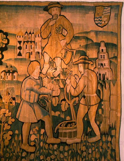 A detail of a tapestry depicting work in the vineyards