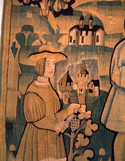 A detail of a tapestry depicting work in the vineyards