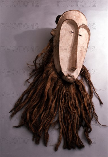 Masks with elongated white faces of this type were used by men of the Fang judiciary association known as Ngil