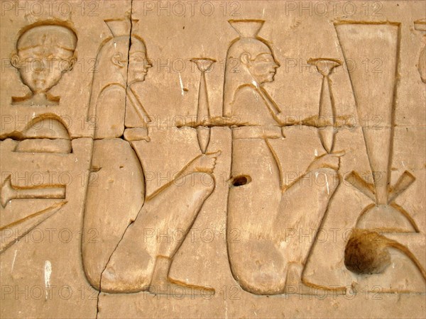 Women holding incense jars on the eastern outside wall of the Sanctuary of Horus