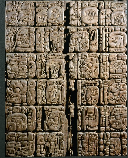 A detail of a carved wood lintel from Temple IV at Tikal, collected in 1877 by the explorer Gustav Bernoulli