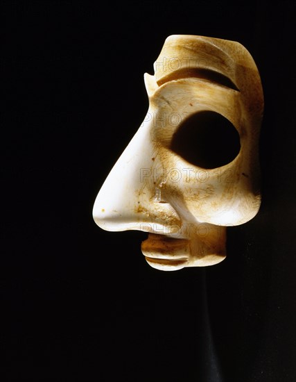 Head, probably from a bearded male votive statuette, with large eye recesses for inlay