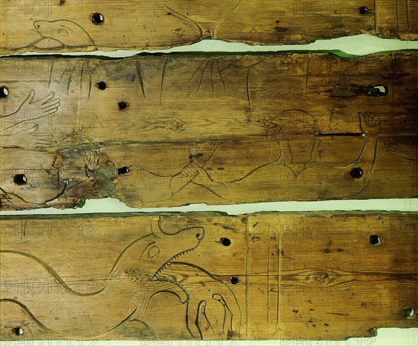 Wood panel depicting Odin being swallowed by Fenrir