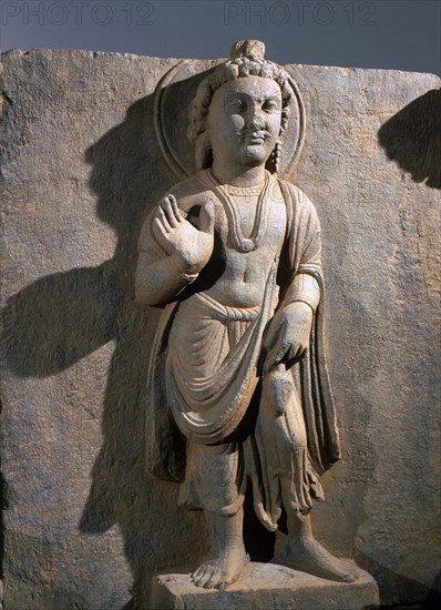 Frieze with depiction of the Reassuring Maitreya flanked by two donors