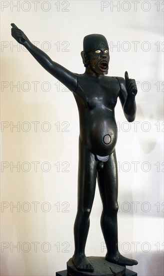 A life size guardian figure   possibly from a graveyard   meant to ward off evil spirits