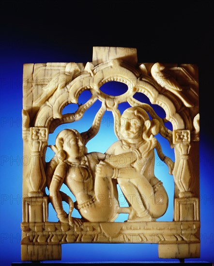 An ivory panel, probably from a bed or a swing, carved with a tantric scene