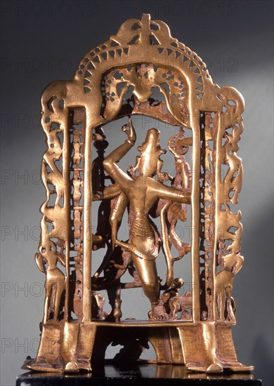 Krishna Venugopala (the cowherd with the flute) framed by a tarana (village gateway) with the columns made up of avatars (incarnations) of Vishnu