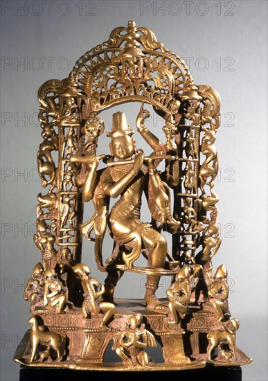 Krishna Venugopala (the cowherd with the flute) framed by a tarana (village gateway) with the columns made up of avatars (incarnations) of Vishnu