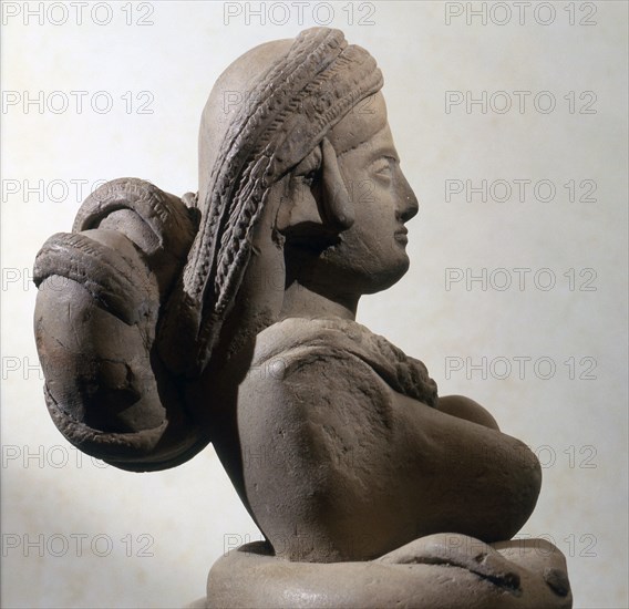 Terracotta statue of serpent goddess