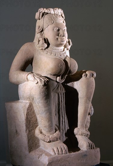 Early example of free standing stone sculpture of a creation goddess