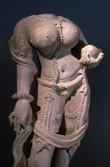 Statue of a voluptuous female deity, standing in tribhanga, the three bend pose which suggests a sensuous  liveliness and maternal energy