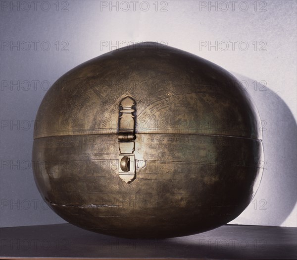 Metalware spherical storage box known as Bhugola or Earth Ball engraved with a representation of the earth as known in Hindu cosmology