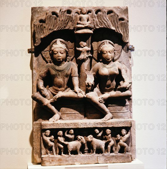 A stele with two seated figures