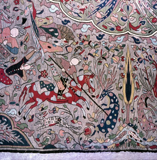 Detail of a Persian style carpet showing hunters on horseback