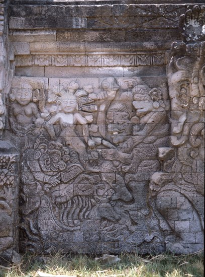 Stone relief on a temple wall at Sangsit, Buleleng