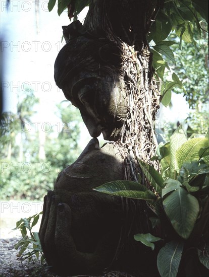 This unique sculpture, showing a womans head cradled in the palm of her lover, may depict Satyawati and Salya from the Balinese version of the Bharatayudha