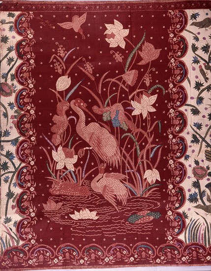 A detail of the design on a batik sarong which incorporates herons and other birds, flowers and water plants