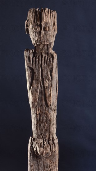 This figurative carving may be a bogy, serving as a site for a village guardian spirit, deterring strangers and enemies