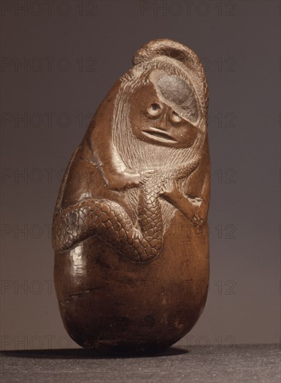 An ancient Indonesian cult object, thought to be a snake god or demon