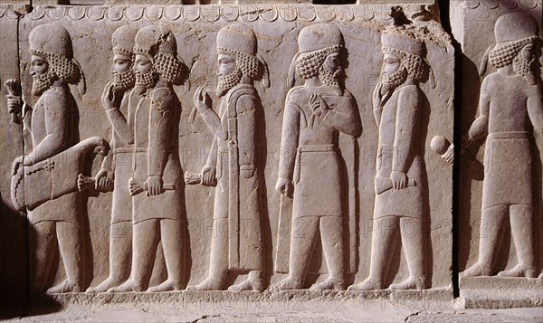 A detail of a relief carving on the staircase leading to the Tripylon at Persepolis, depicting the procession of Medes and Persians