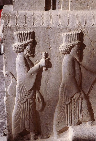 A detail of a relief carving on the staircase leading to the Tripylon at Persepolis, depicting the procession of Medes and Persians