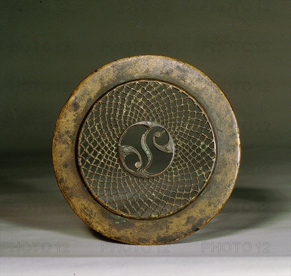 Openwork bronze ornament, function remains unknown