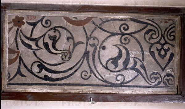 Tile with floral decoration