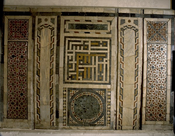 Mosaic panel with an inscription in the central square written in the interlocking script known as puzzle Kufic