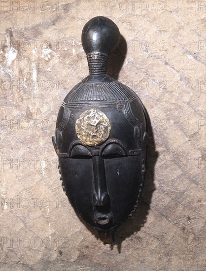 Kpan mask, one of a pair representing the senior female masqueraders in a four part performance called Goli