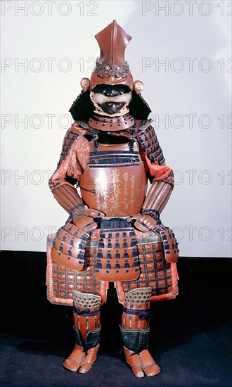 This suit of armour bears a Buddhist gold lacquer inscription on the breastplate