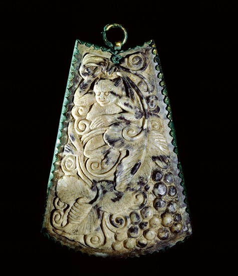 Calcified white jade pendant decorated in relief on both sides and set into a gilded bronze beaded frame