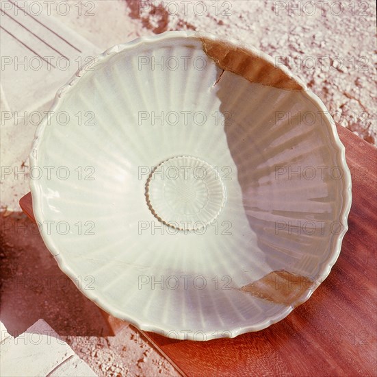 A Sung dynasty celadon plate with the lotus flower design