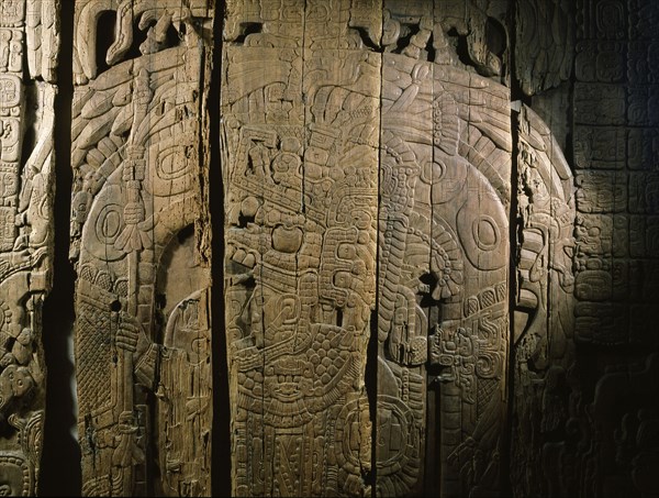 A detail of a carved wood lintel from Temple IV at Tikal, collected in 1877 by the explorer Gustav Bernoulli