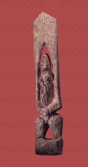 A wood sculpture of a nommo figure, the offspring of the Dogon creator god, Amma and his Earth wife
