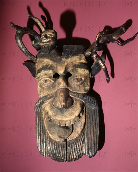 Mask of a horned, bearded devil, worn during dances to pacify evil spirits