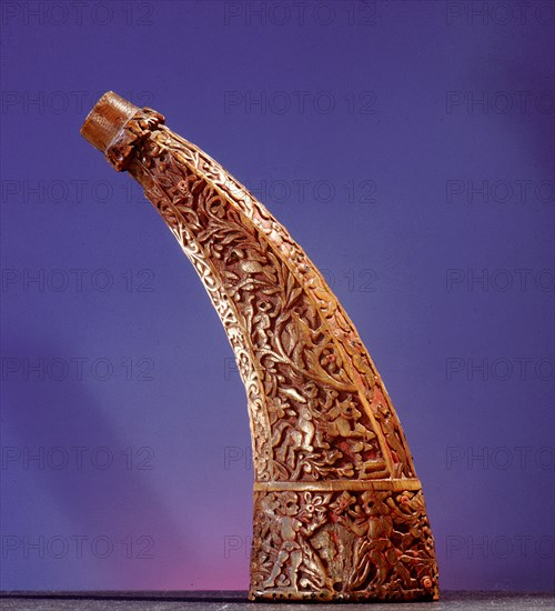 Powder horn carved with Aztec motifs and gods as well as a Spanish ship