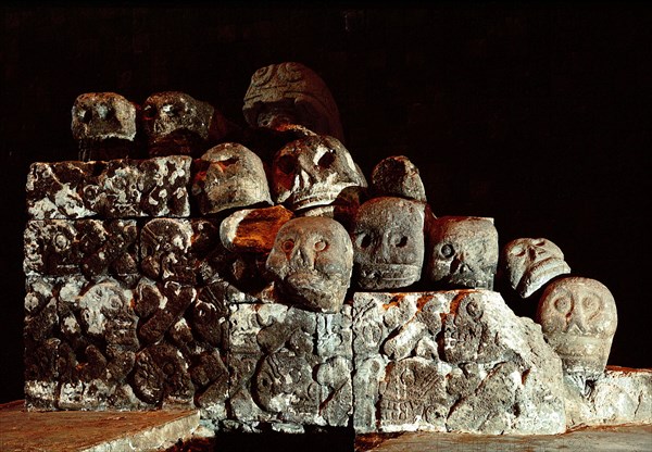 Collapsed carving of a Tzompantli, or skull rack