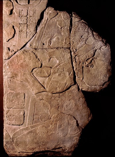 Stone tablet with a relief depicting a priest making offerings to a cacao plant